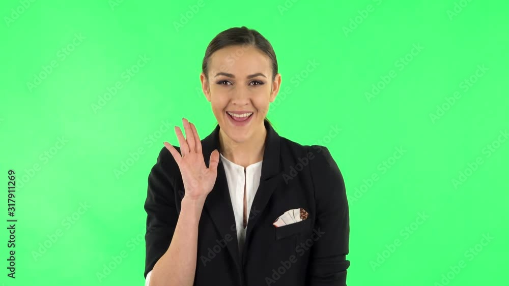 Girl screams calling someone on a green screen at studio Girl screams calling someone on a green screen at studio