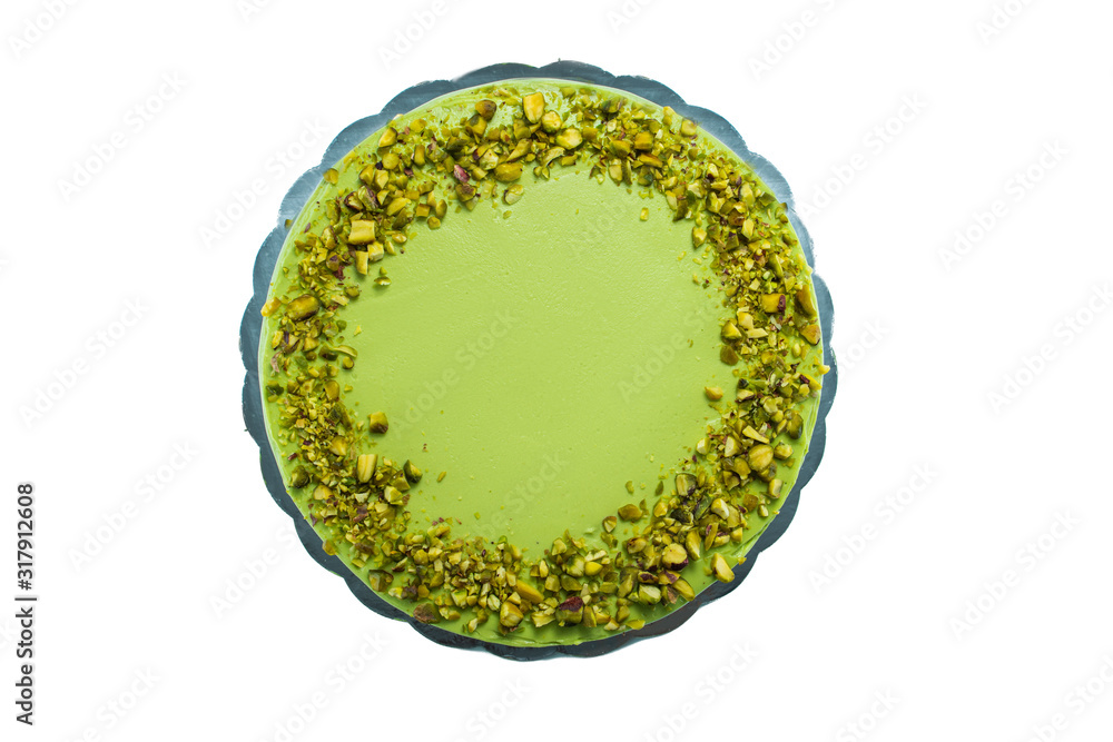 Cake with fruity cream and pistachio decorated with nuts, isolated Cake with fruity cream and pistachio decorated with nuts, isolated