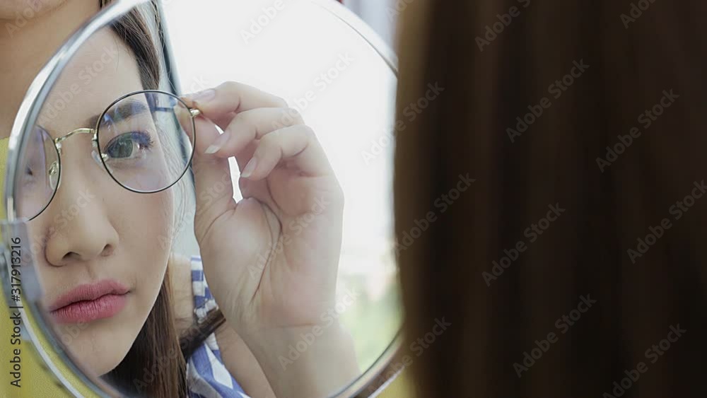 Close up secne video of smiling beautiful Asian woman try glasses in ...