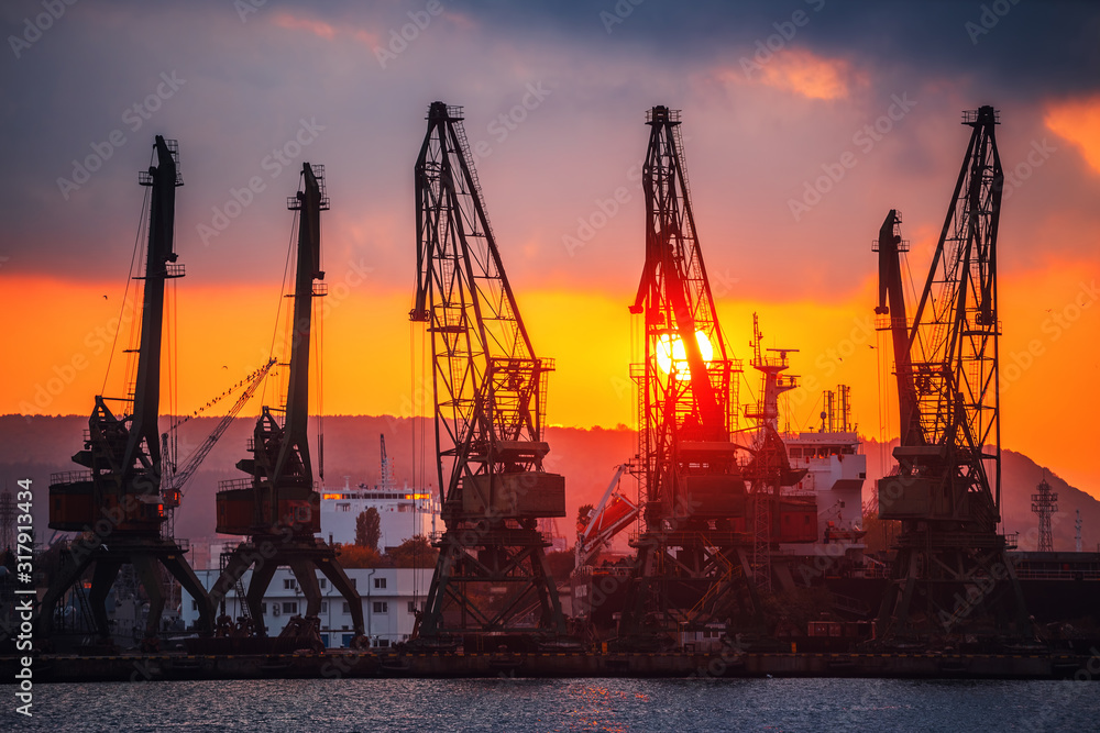 Sunset over sea port and industrial cranes, Varna