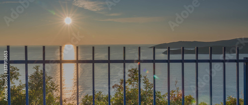 Obraz na płótnie Golden sunrise sunset over the Adratic sea in Montenegro, view from the top of the Mogren Fortress in Budva.Quiet place. Relaxing scene.Calm sea water. Beautiful colors in the sky. w salonie