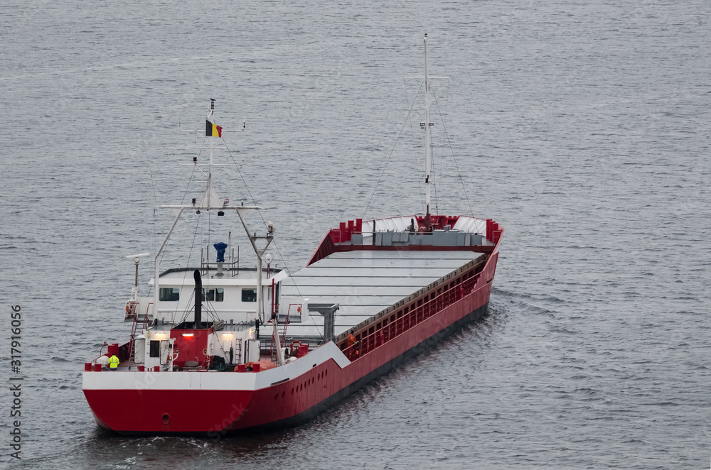 MERCHANT VESSEL - The ship sails with freight to port MERCHANT VESSEL - The ship sails with freight to port