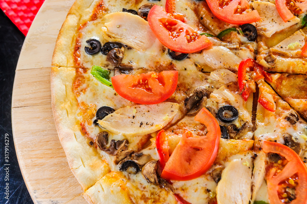 Pizza on table close up.Cut pizza.Italian traditional dish. Pizza on table close up.Cut pizza.Italian traditional dish.