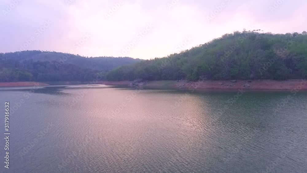 cool color water,Beautiful aerial shot of a large forest lake,evening sky cool color water,Beautiful aerial shot of a large forest lake,evening sky