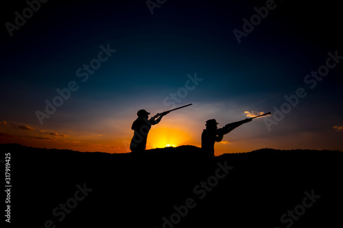 Hunters and rifle silhouette women