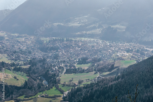 The town of Borno in the Italian mountains, seen from above during a winter day - December 2019.