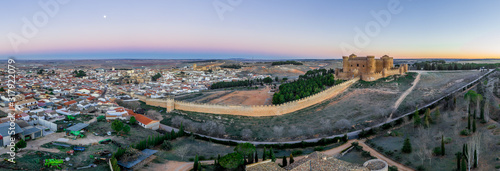 Aerial panorama view of Belmonte castle in Cuenca province Spain with long stretching city walls topped with battlements