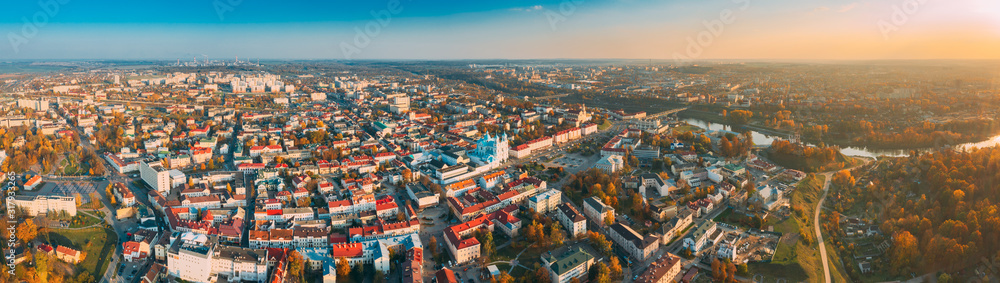 Grodno, Belarus. Aerial Bird's-eye View Of Hrodna Cityscape Skyline. Famous Popular Historic Landmarks In Sunny Autumn Evening. Panorama in Sunset Lights