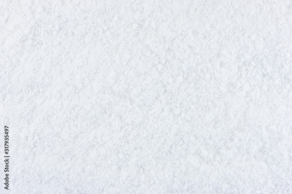 Fototapeta premium Winter snow texture. Top view of the snowy white texture. Snowflakes.