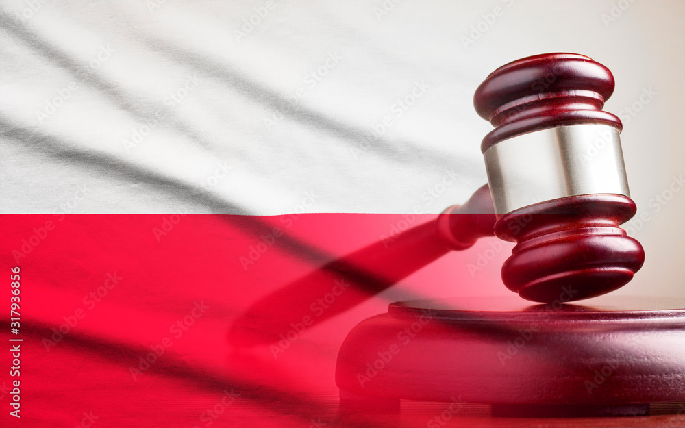 Legal gavel over a flag of the Poland