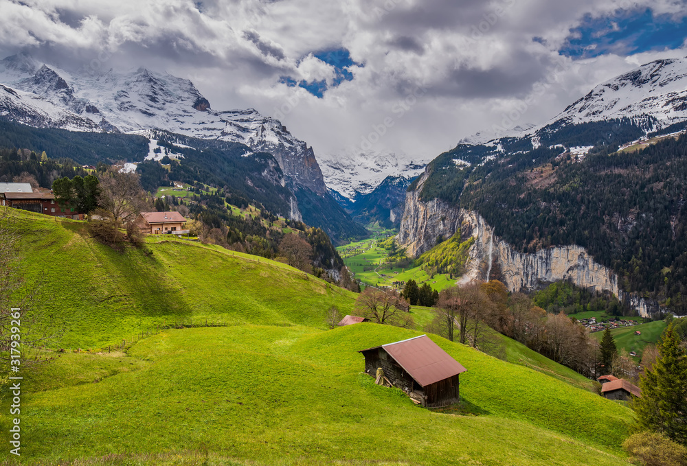 Picturesque view of sunlit meadow in Wengen Village and Lauterbrunnen valley, Bernese Oberland, Switzerland