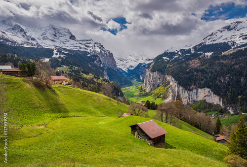 Picturesque view of sunlit meadow in Wengen Village and Lauterbrunnen valley, Bernese Oberland, Switzerland