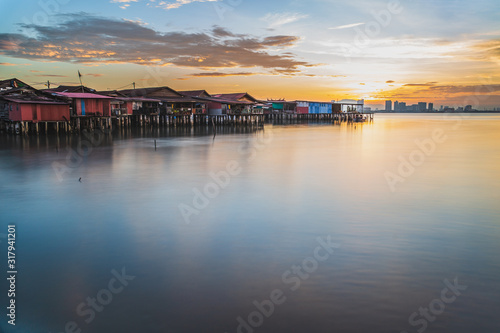 Chew jetty fisherman village in George Town Penang Malaysia at sunrise. photo