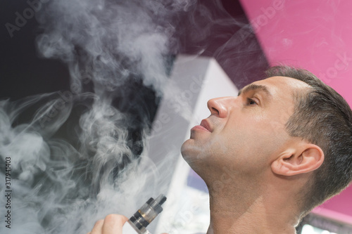 a man smoking with vaporizer