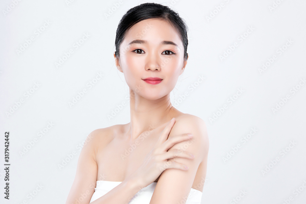 Beautiful Young Asian Woman with Clean Fresh Skin. Face care, Facial treatment, on white background, Beauty and Cosmetics Concept. Beautiful Young Asian Woman with Clean Fresh Skin. Face care, Facial treatment, on white background, Beauty and Cosmetics Concept.