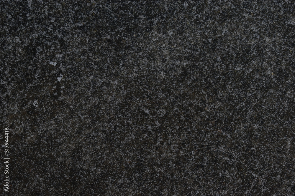 Fototapeta premium Asphalt pavement covered with snow in winter.