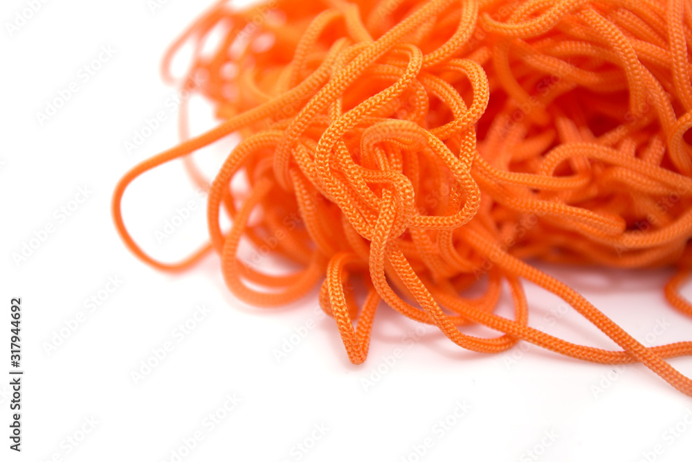 orange thread on a white background close-up orange thread on a white background close-up