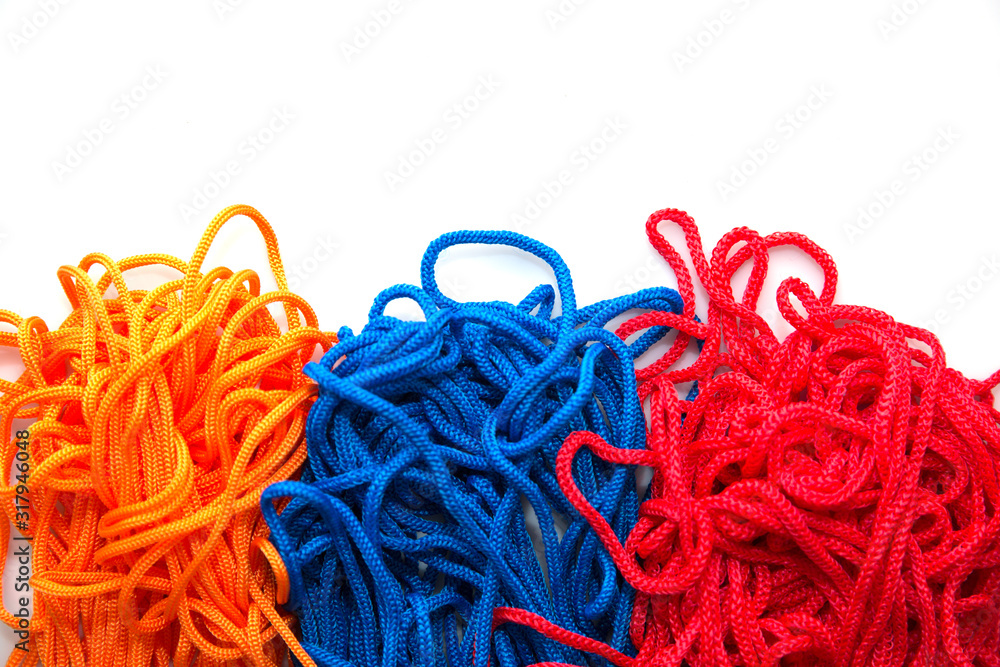 multi-colored threads on a white background close-up multi-colored threads on a white background close-up