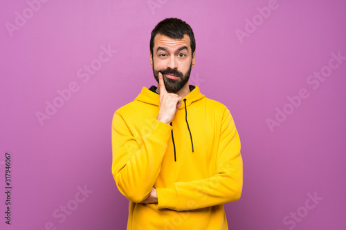 Handsome man with yellow sweatshirt Looking front