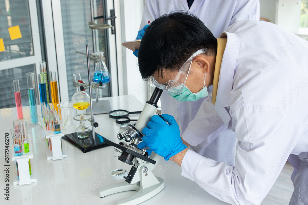 Scientists or doctors are testing bloods to prevent and destroy new strains of the virus through microscopy. Researching and experimenting for effective chemicals. Protect and Repair. Scientists or doctors are testing bloods to prevent and destroy new strains of the virus through microscopy. Researching and experimenting for effective chemicals. Protect and Repair.