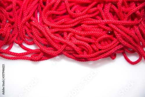 red threads on white background close-up