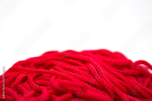 red threads on white background close-up 