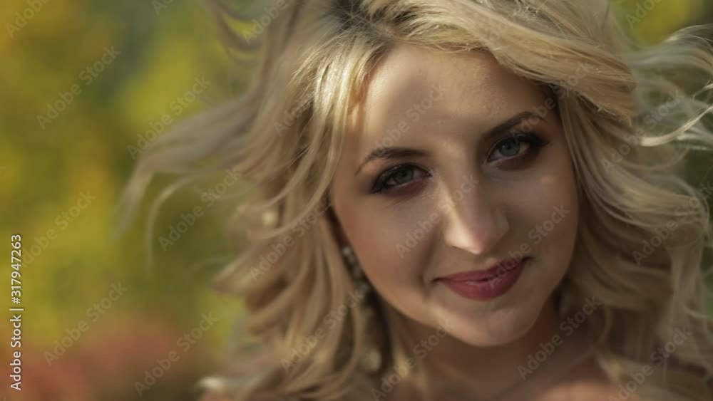 Beautiful and lovely bride in the park. Pretty and well-groomed woman. Beautiful and lovely bride in the park. Pretty and well-groomed woman.