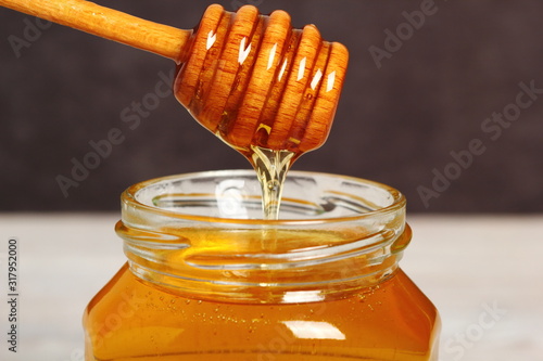 Jar of Honey with Honey Dipper photo