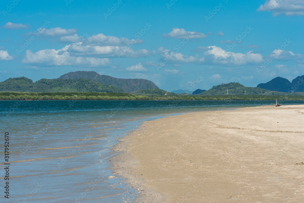 Long white sandy beaches in the north side of the island of Ko Lanta Yai. The north side of the island includes a protected area, the Mu Ko Lanta National Park and a many mangrove forest