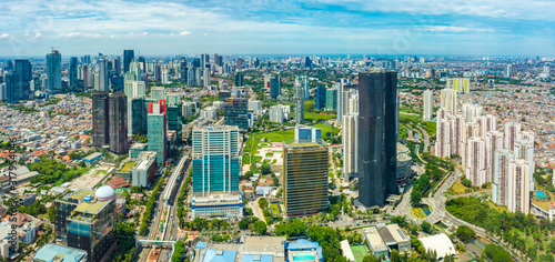 Jakarta, Indonesia - CIRCA 2018: Aerial view of Jakarta's Central Business District at a sunny morning. Sunlight falls on the building.