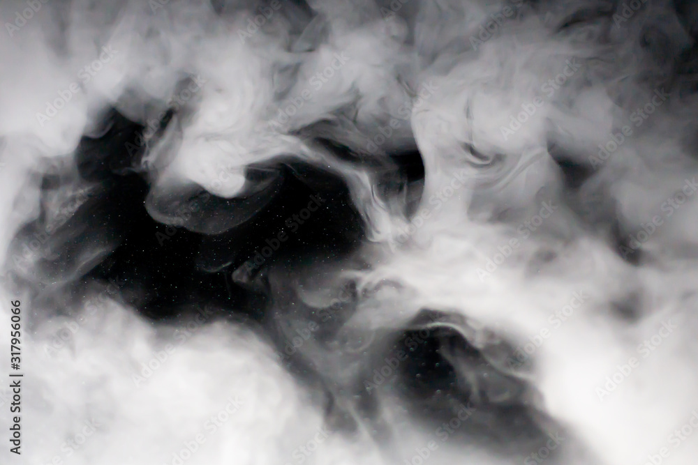 Dense veil of bright white smoke (fog, vapor) with a hole (window) in the middle on a dark black background, making up intricate beautiful patterns