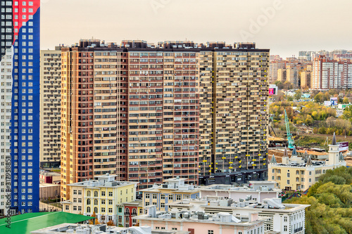 Commuter town in night lights. Pavshino district of Krasnogorsk, Moscow region, Russia. Entire street is newly built in development area with numerous residential buildings. Moscow suburb photo