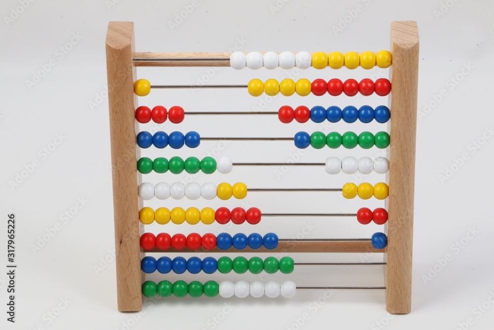 small ruler with colorful wooden balls in a white studio small ruler with colorful wooden balls in a white studio