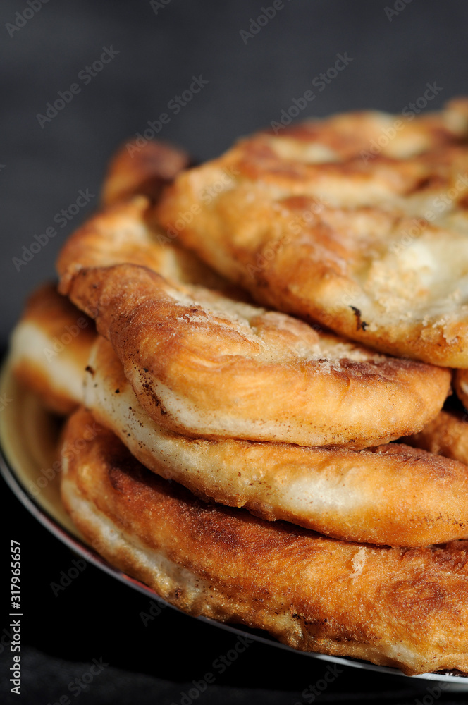 Freshly baked potato patties on a plate. Shallow depth of field