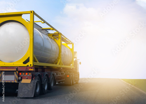 Gas Truck on highway road with tank oil  container, transportation concept.,import,export logistic industrial Transporting Land transport on the asphalt expressway with blue sky photo