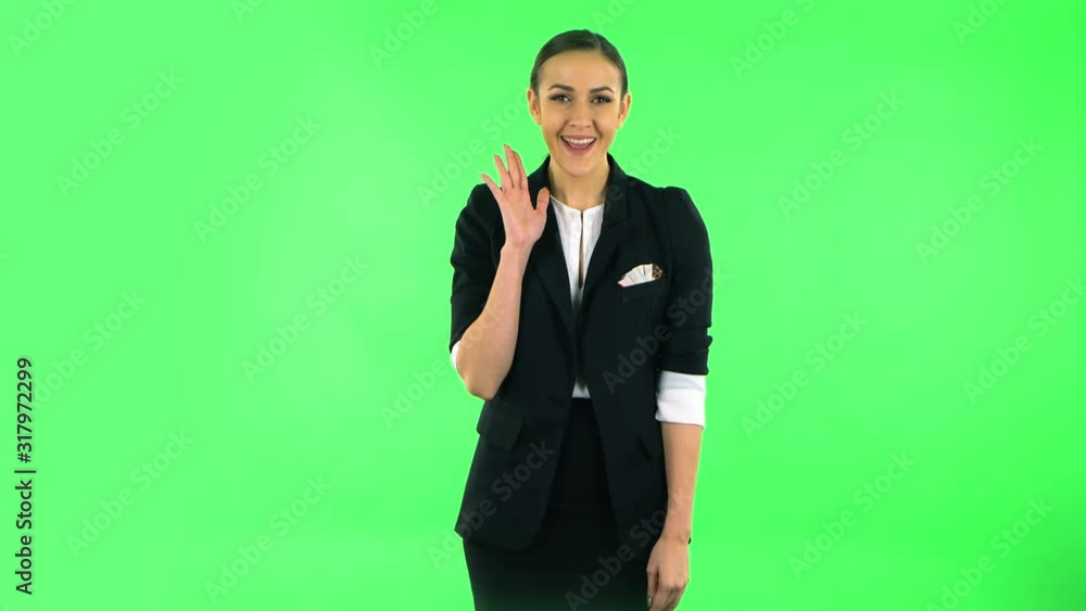 Girl screams calling someone on a green screen at studio Girl screams calling someone on a green screen at studio