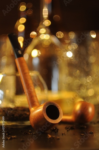 Brown smoking pipe close-up with bokeh in the background © Ольга Толкачева