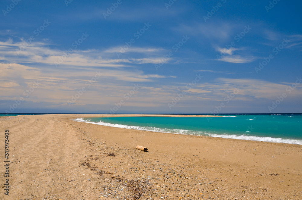 Sandy beach on the azure sea coast