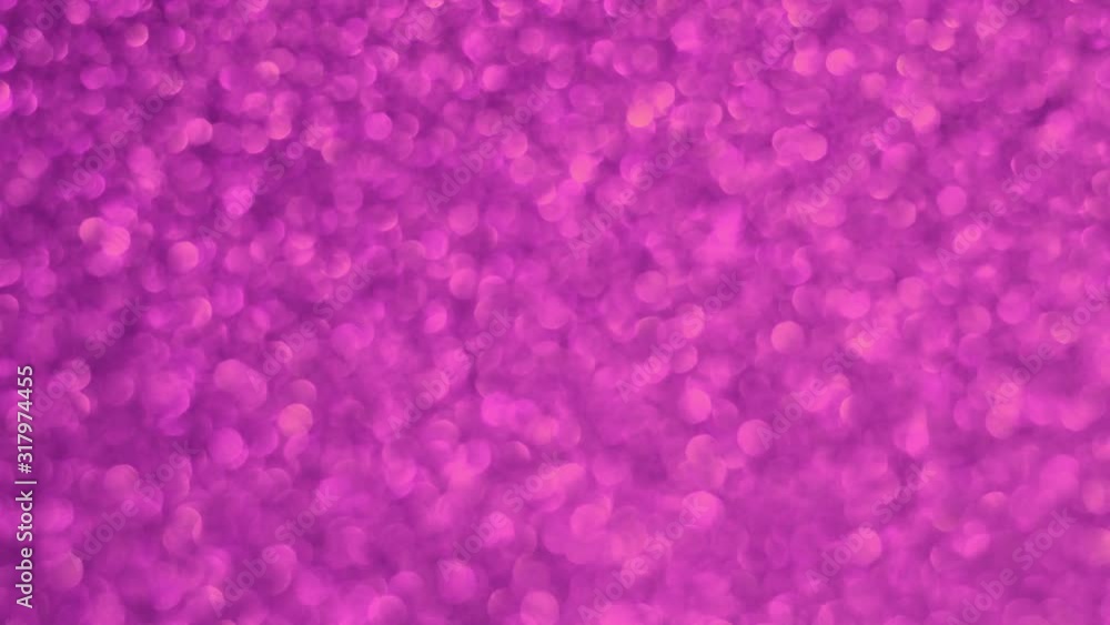 Purple background with sequins. Magic video bokeh effect. Purple background with sequins. Magic video bokeh effect.