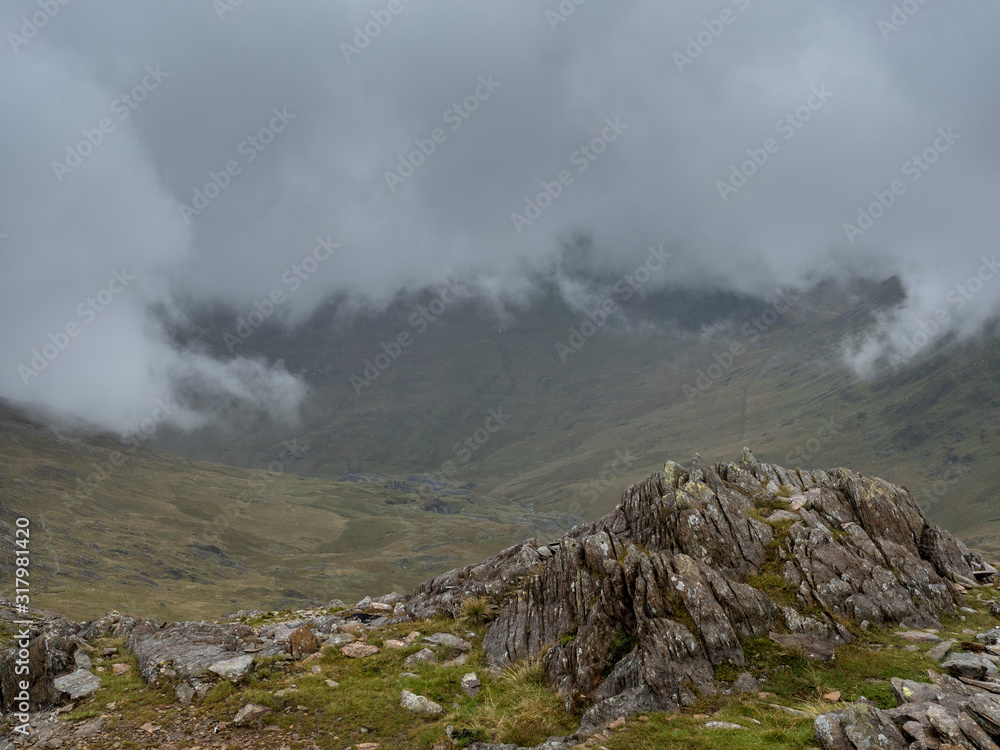 Rock party with lichen in the foreground on the Snowdonia mountain in Wales Rock party with lichen in the foreground on the Snowdonia mountain in Wales