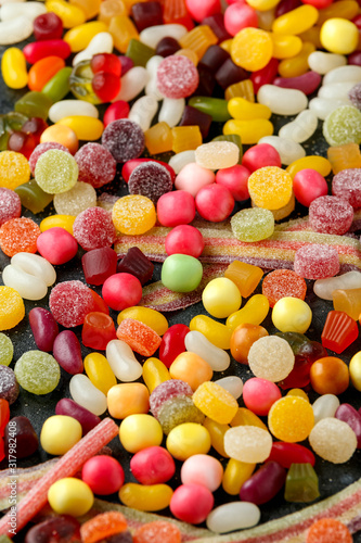 A mix of colorful candy on background  texture