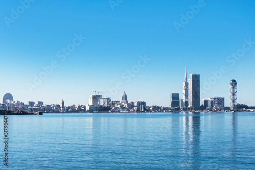 Blue sky color Batumi cityscape. Empty copy space Georgian city panoramic view. Sea shore touristic district.