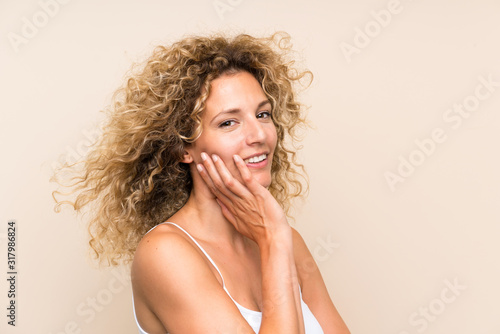 Young blonde woman with curly hair