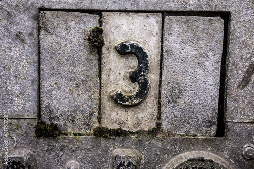 Written Wording in Distressed State Typography Found Number Three