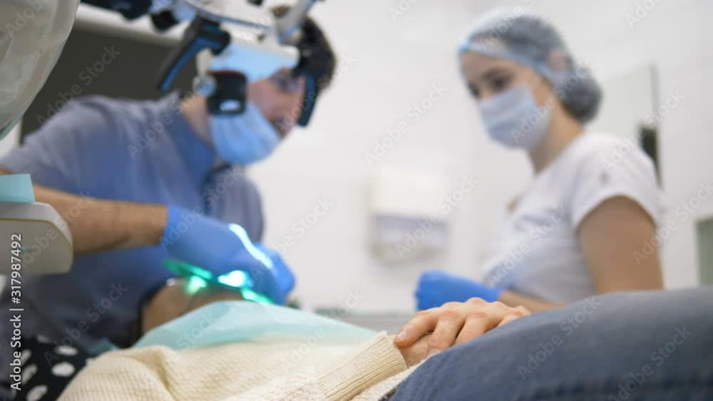professional dental clinic personnel operates patient professional dental clinic personnel operates patient
