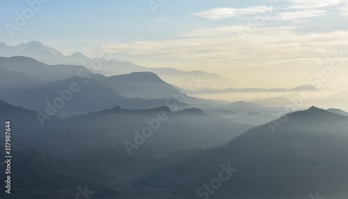mountains range  in fog winter season sarankot nepal © decha