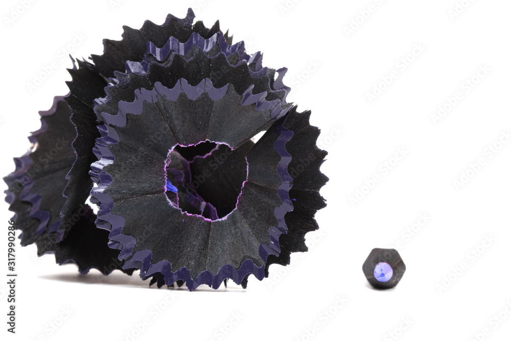 Obraz premium purple pencil and shavings on white paper background