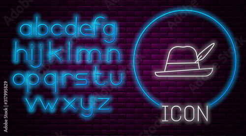 Glowing neon line Oktoberfest hat icon isolated on brick wall background. Hunter hat with feather. German hat. Neon light alphabet. Vector Illustration