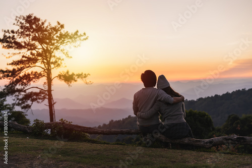 Young couple traveler looking beautiful landscape at sunset, Travel lifestyle concept