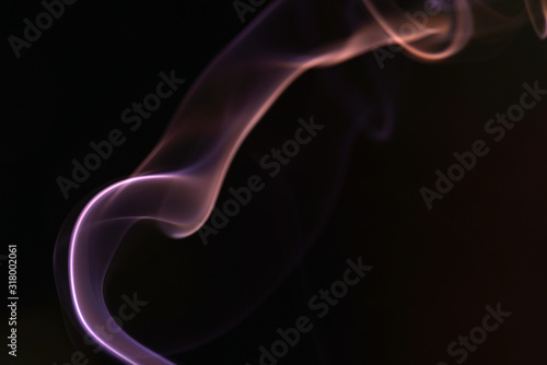 Smoke flashed with colorful foils and photographed in the studio